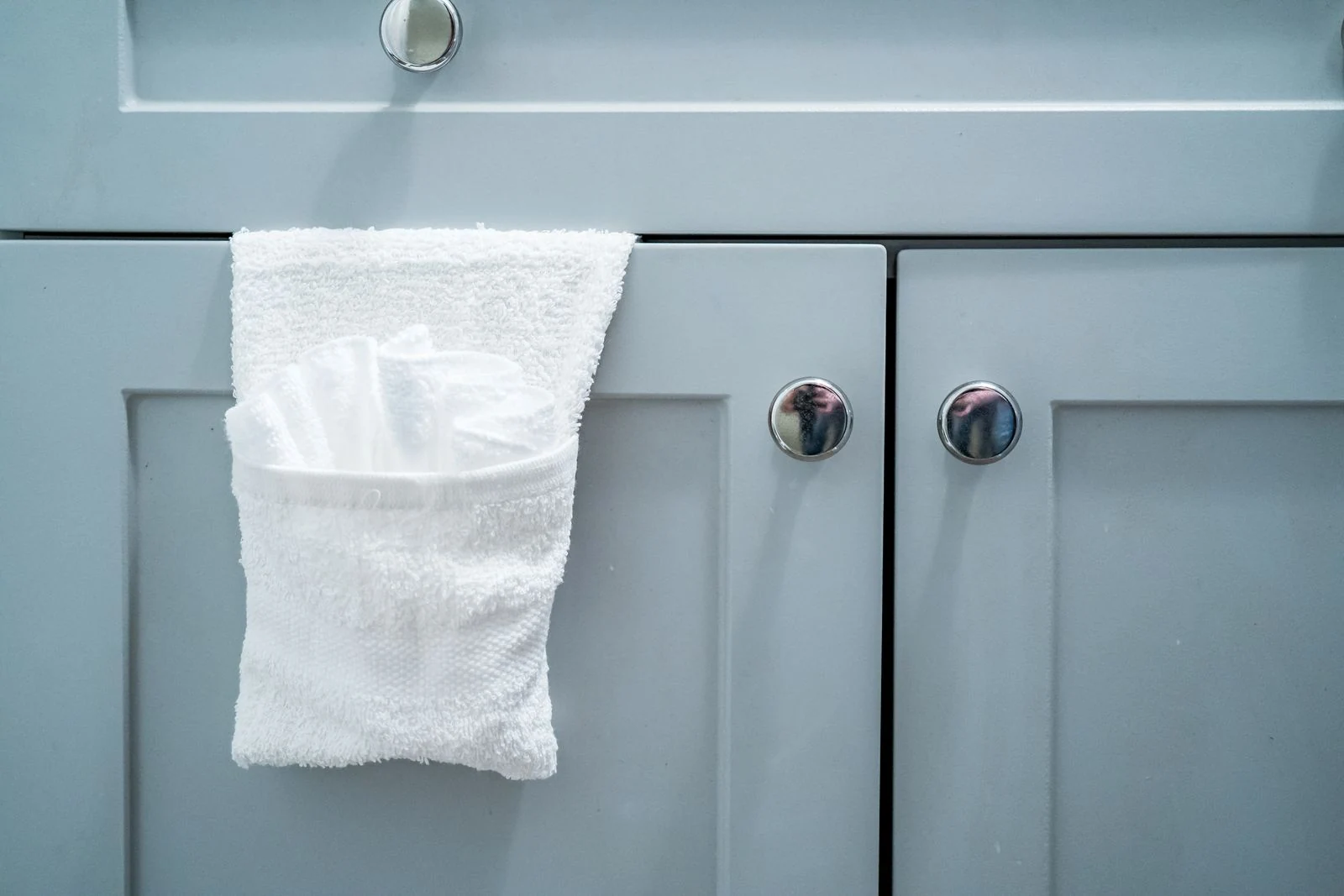 Towel hanging on a bathroom cabinet