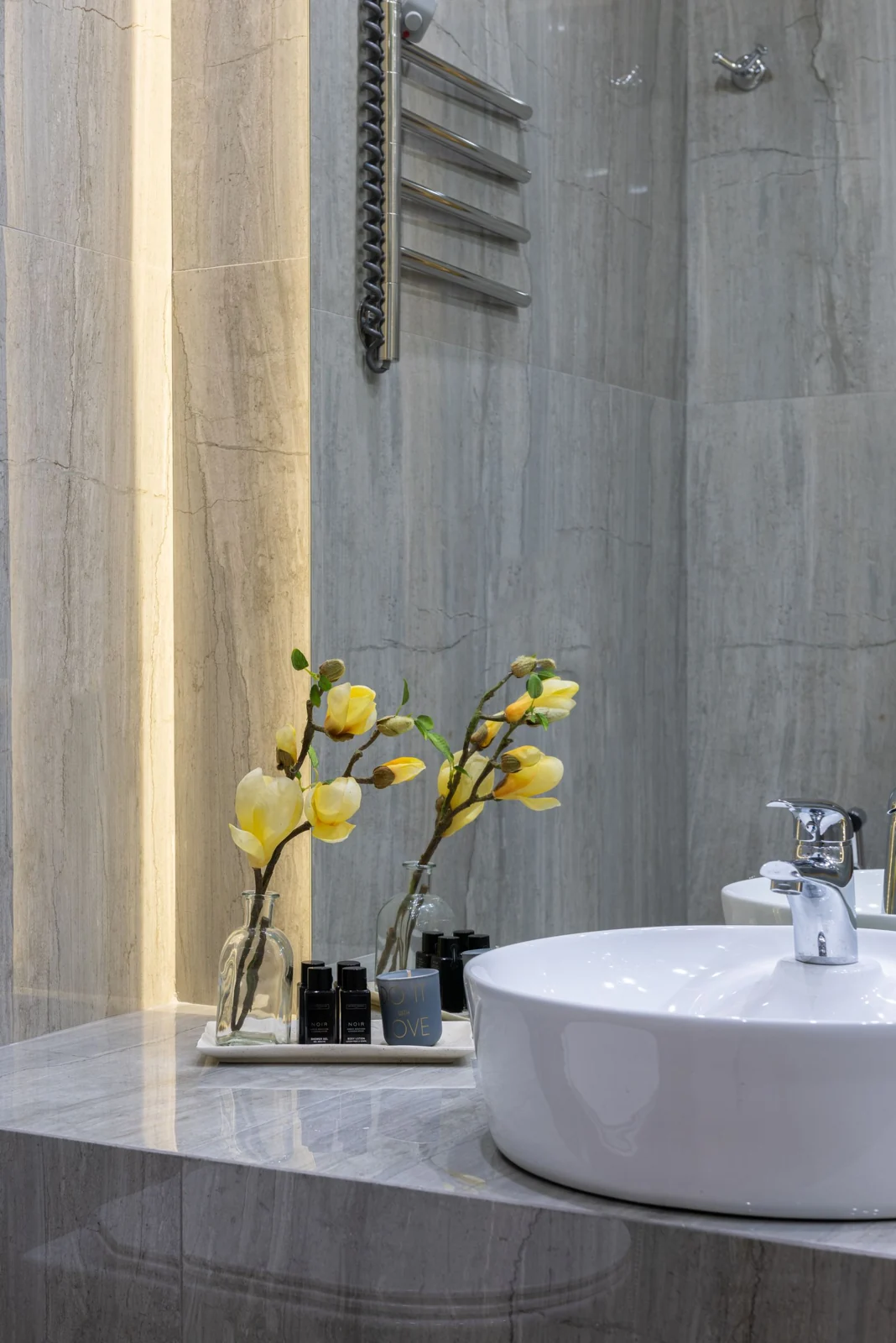 Bathroom basin on a tiled vanity