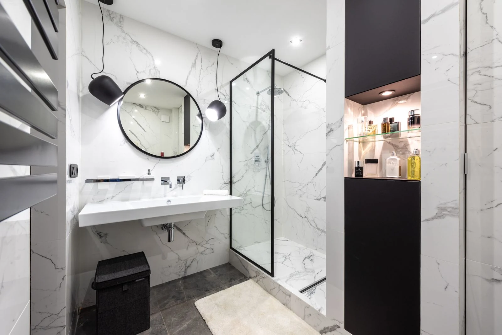 Bathroom mirror and basin beside a shower