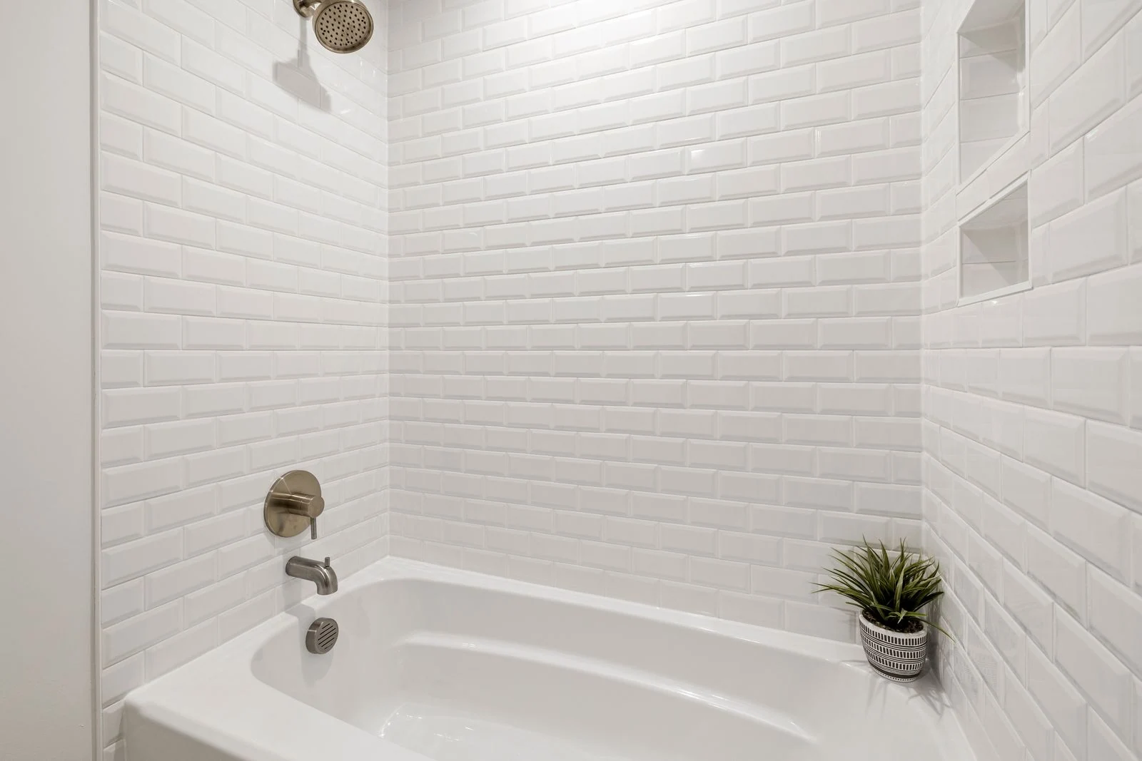 Shower fittings above a fitted bath